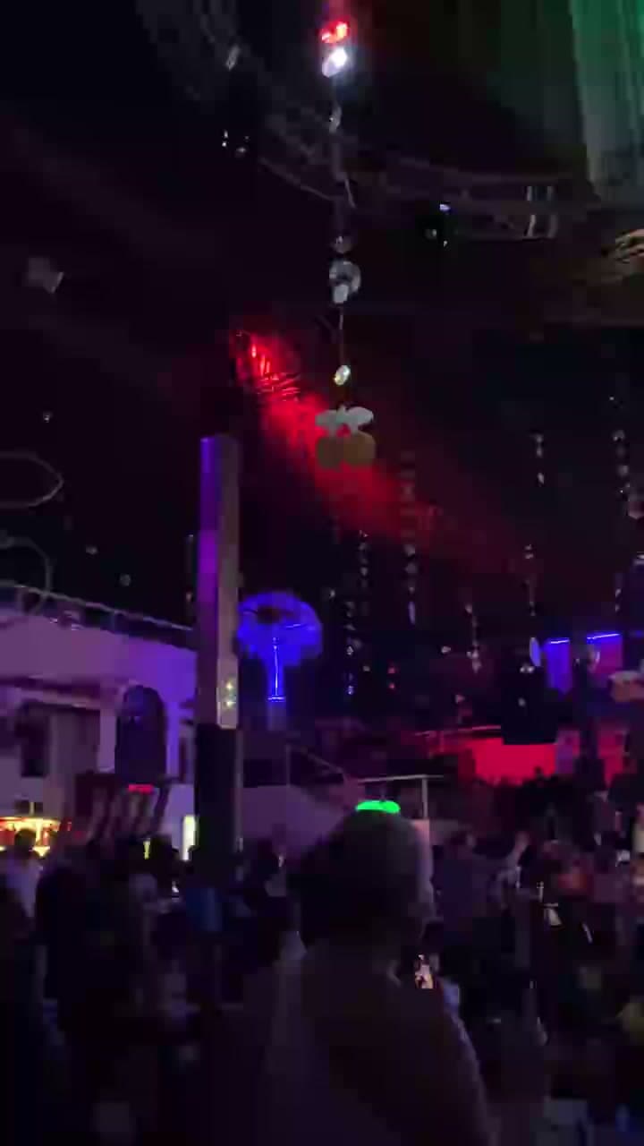 Lights and a crowd inside a nightlife venue
